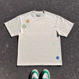 Riolio Wang Studio 240G Versatile Floral ort Sve T-irt for Students ex Simple Design Faionable Sun Protection irt